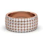 Rose gold ring with diamond accents on a white background