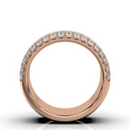 Rose gold ring with diamonds on a white background