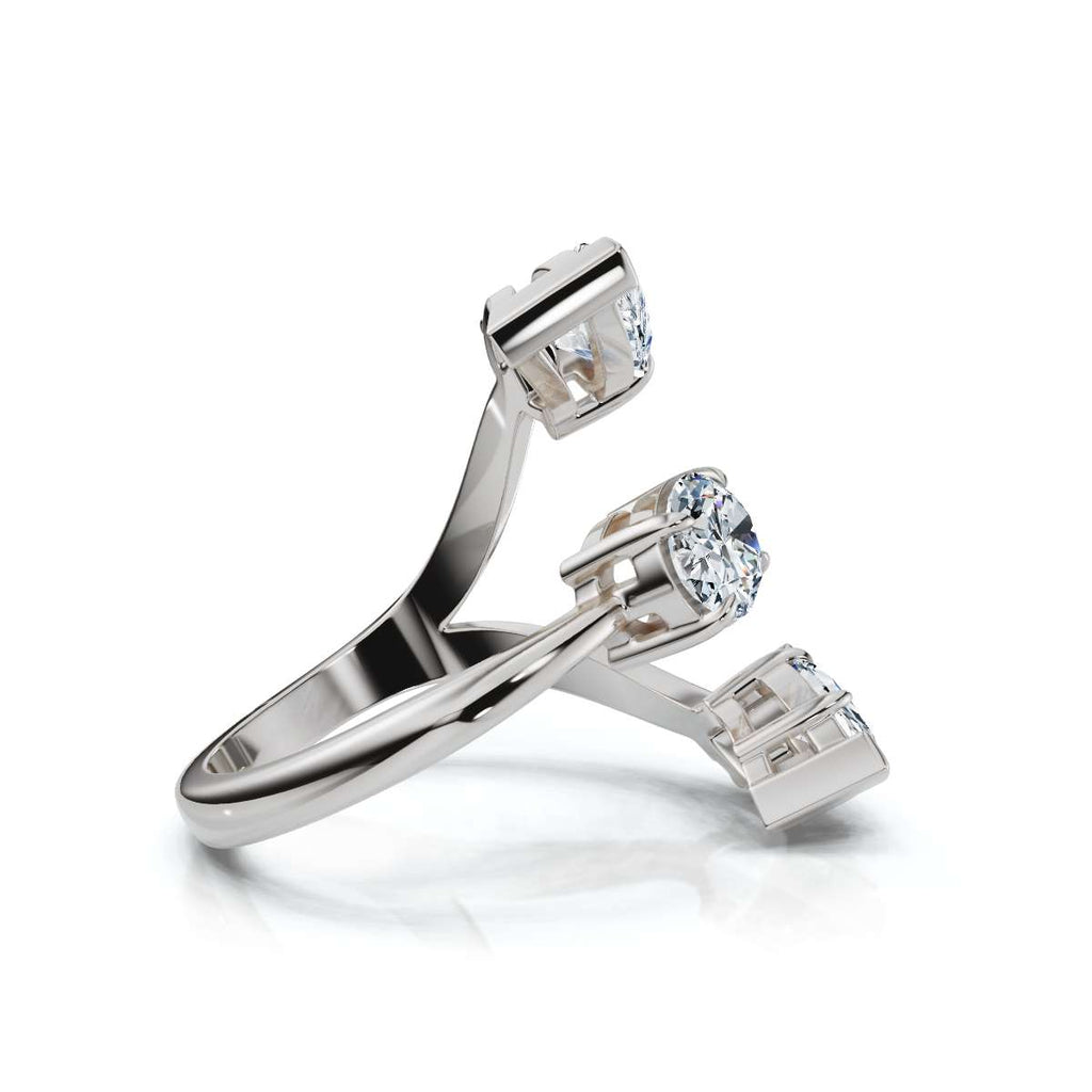 White gold ring with pear-shaped diamonds on a white background
