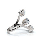 White gold ring with pear-shaped diamonds on a white background