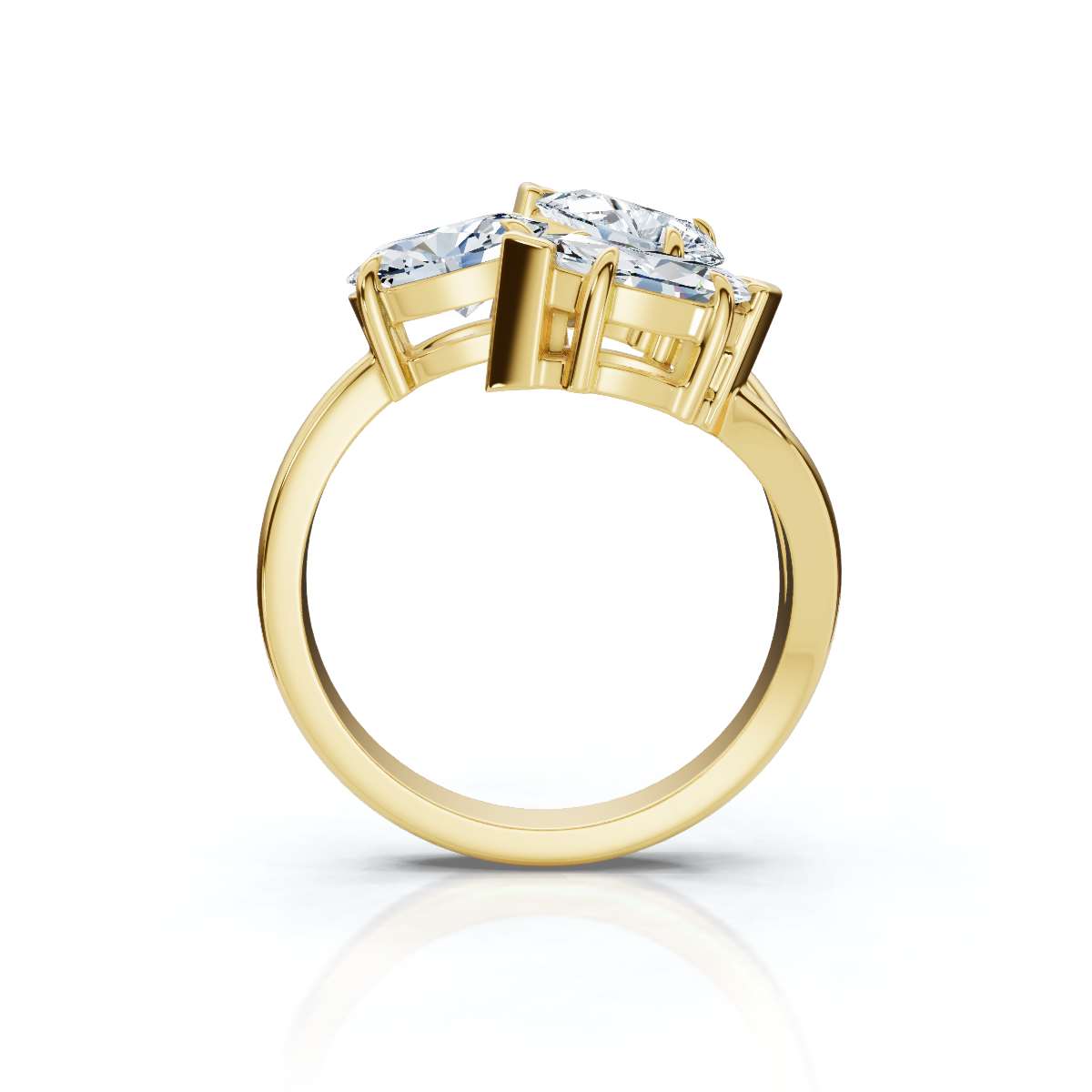 Gold ring with three diamond stones on a white background