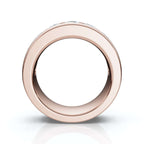 Rose gold ring with nine embedded stones on a white background