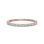Rose gold ring with diamonds on a white background