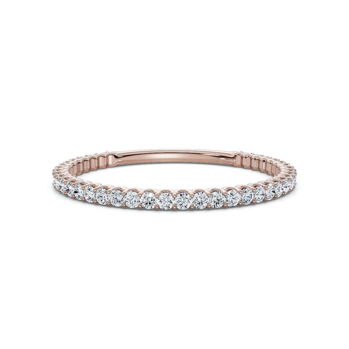 Rose gold ring with diamonds on a white background