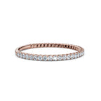 Rose gold ring with diamonds on a white background