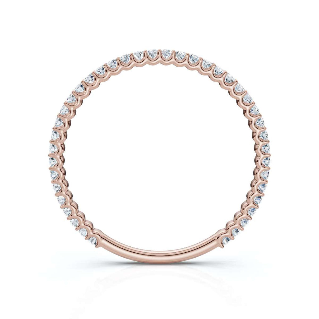 Rose gold ring with diamonds on a white background