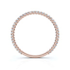 Rose gold ring with diamonds on a white background