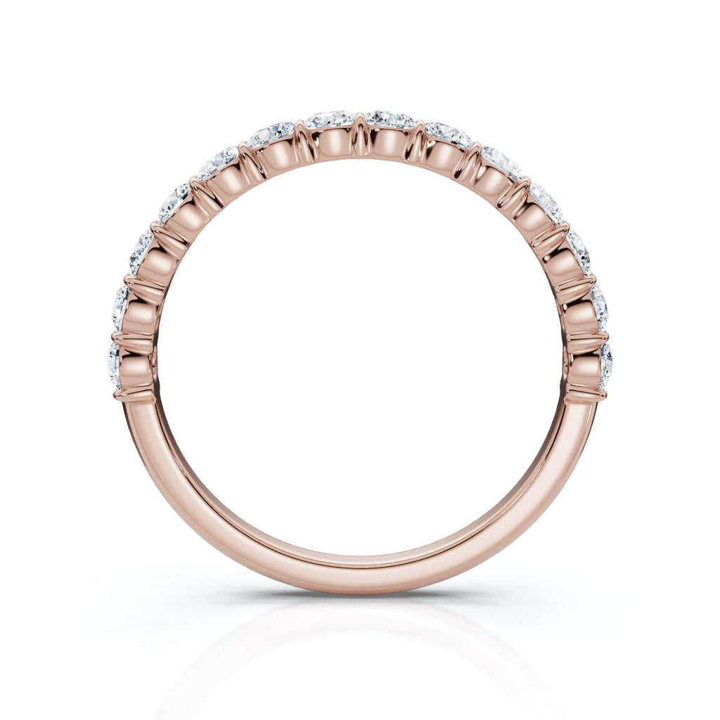 Rose gold ring with diamonds on a white background