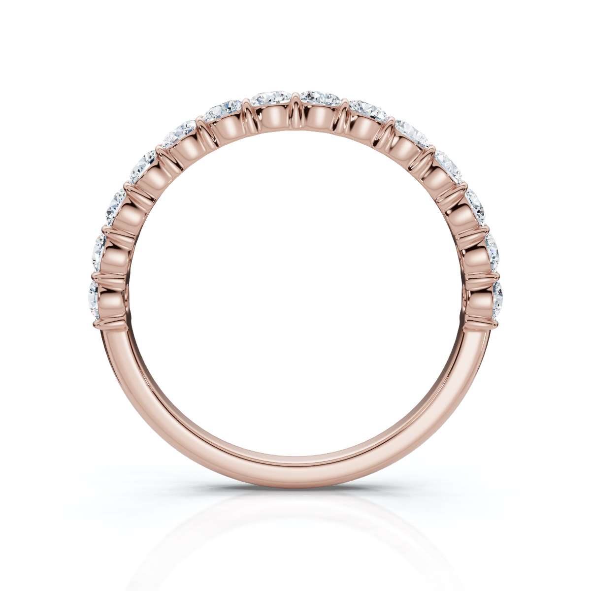 Rose gold ring with diamonds on a white background