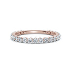 Rose gold ring with diamonds on a white background