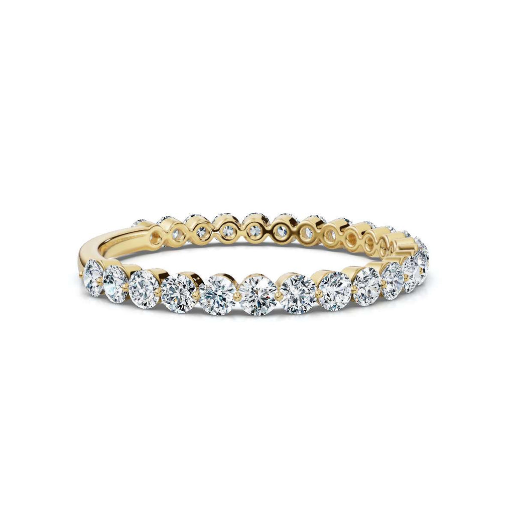 Gold and diamond ring on a white background