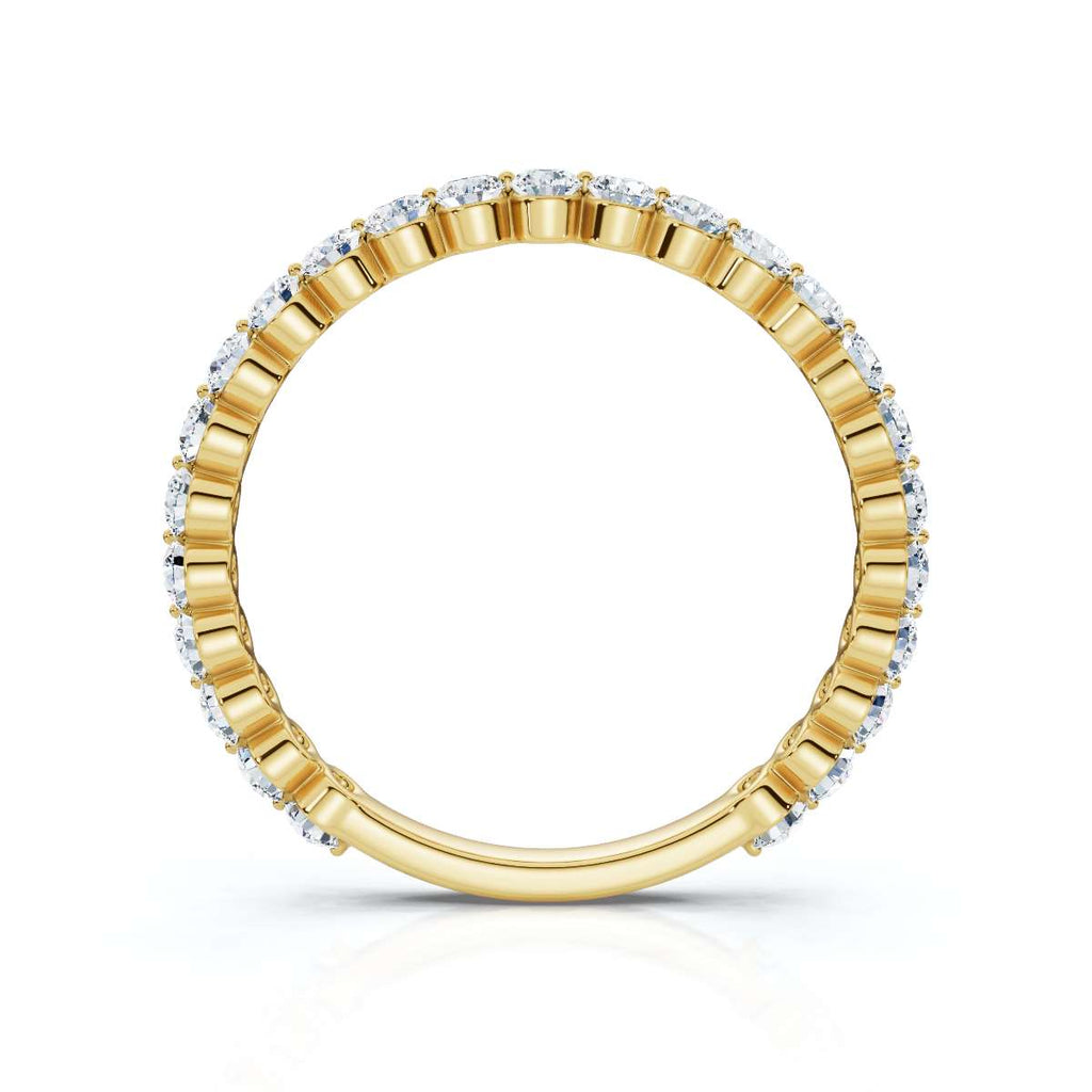 Gold ring with embedded diamonds on a white background