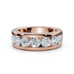 Rose gold ring with nine diamonds on a white background