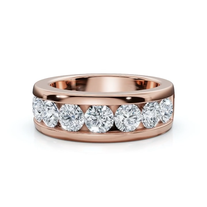Rose gold ring with nine diamonds on a white background